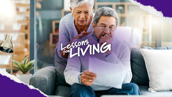 Older man and woman looking at papers